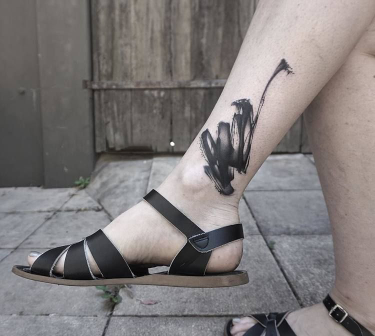 Black Abstract paintbrush ankle tattoo