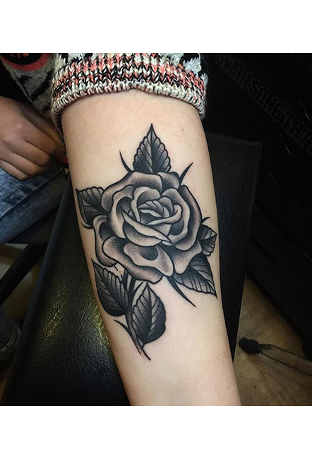 Black rose tattoos on hand