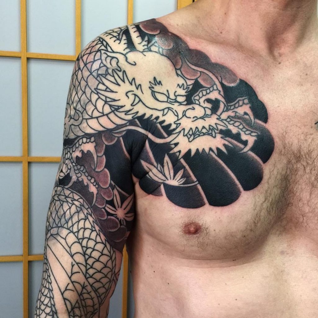 Boy front chest black dragon tattoo