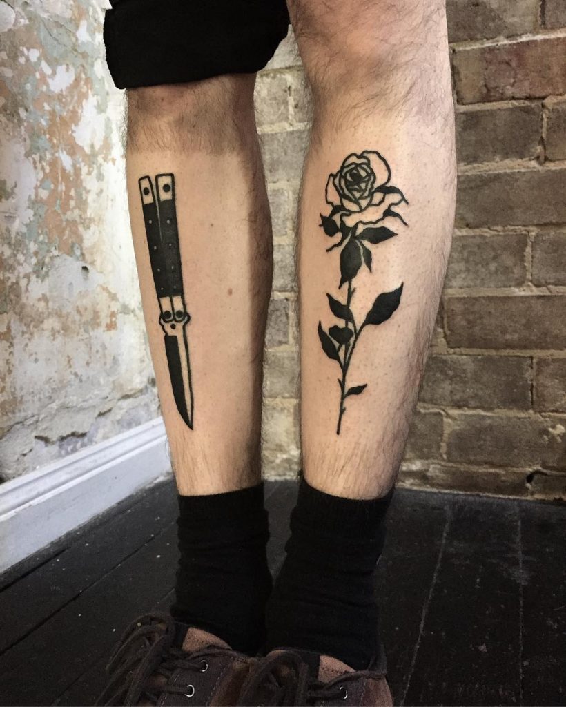 Butterfly knife and black rose tattoos