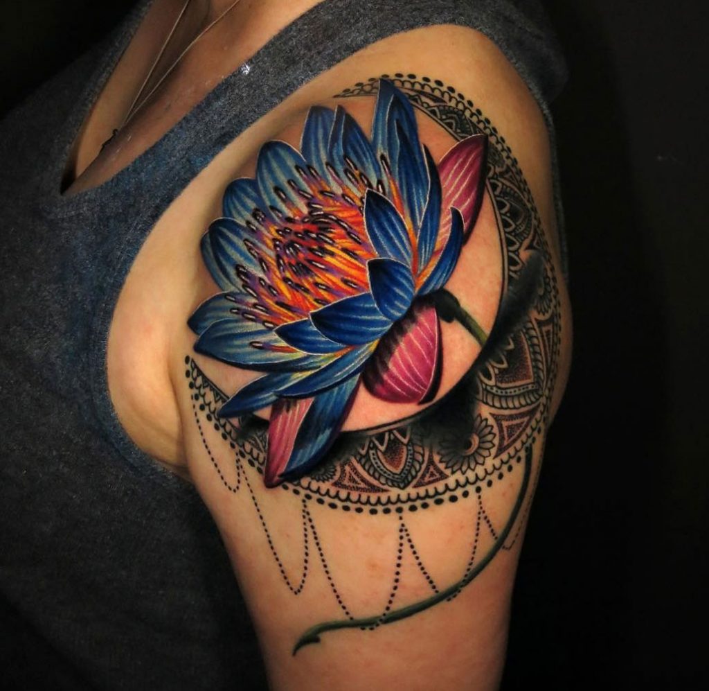 Colorful lotus flower shoulder tattoo
