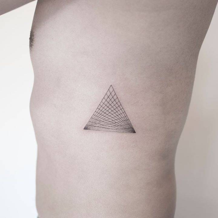 Dotwork Style Triangle Tattoo On The Rib Cage