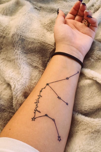 Girl forearm constellation line tattoo