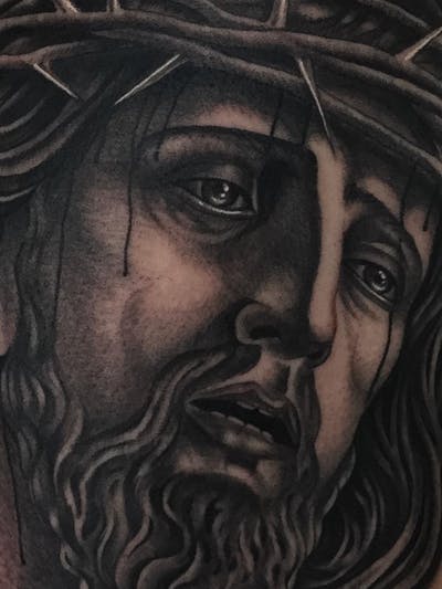 Jesus traditional tattoo black and grey