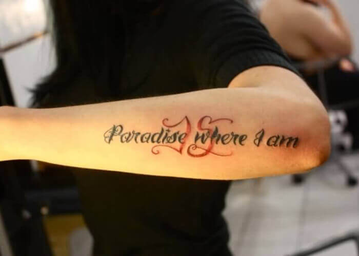 Lettering forearm tattoo