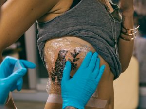 Make sure your artist covers your new tattoo with a bandage
