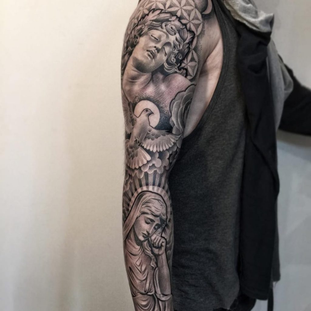 Man rigth forearm black and gray tattoo