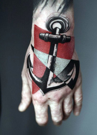Man with tattoos abstract anchor on hands