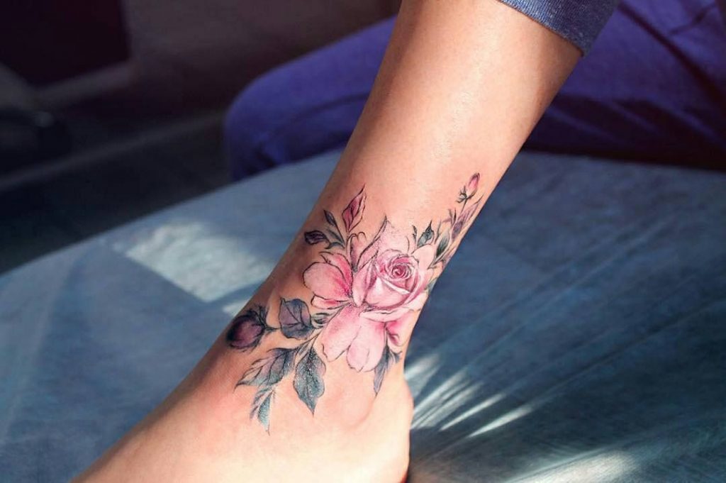 Pink rose flower tattoo on the ankle