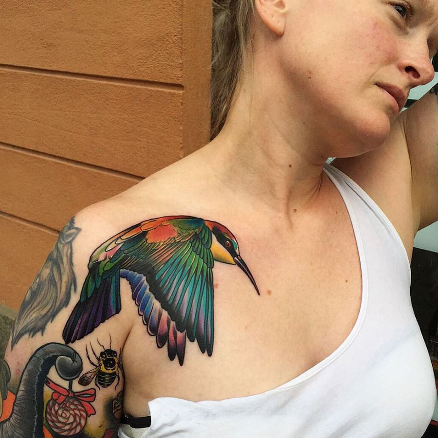 Pride bird chest tattoo