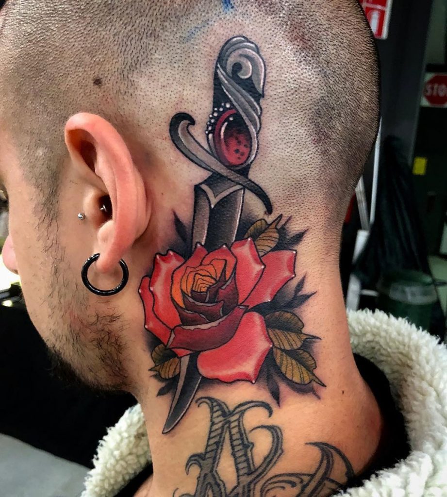 Rose dagger head neck tattoo