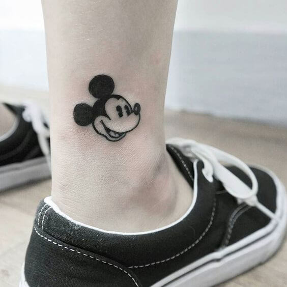 Small mickey mouse cartoon tattoo on ankle