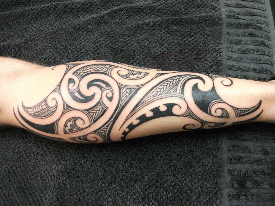 Tribal left Arm Tattoo