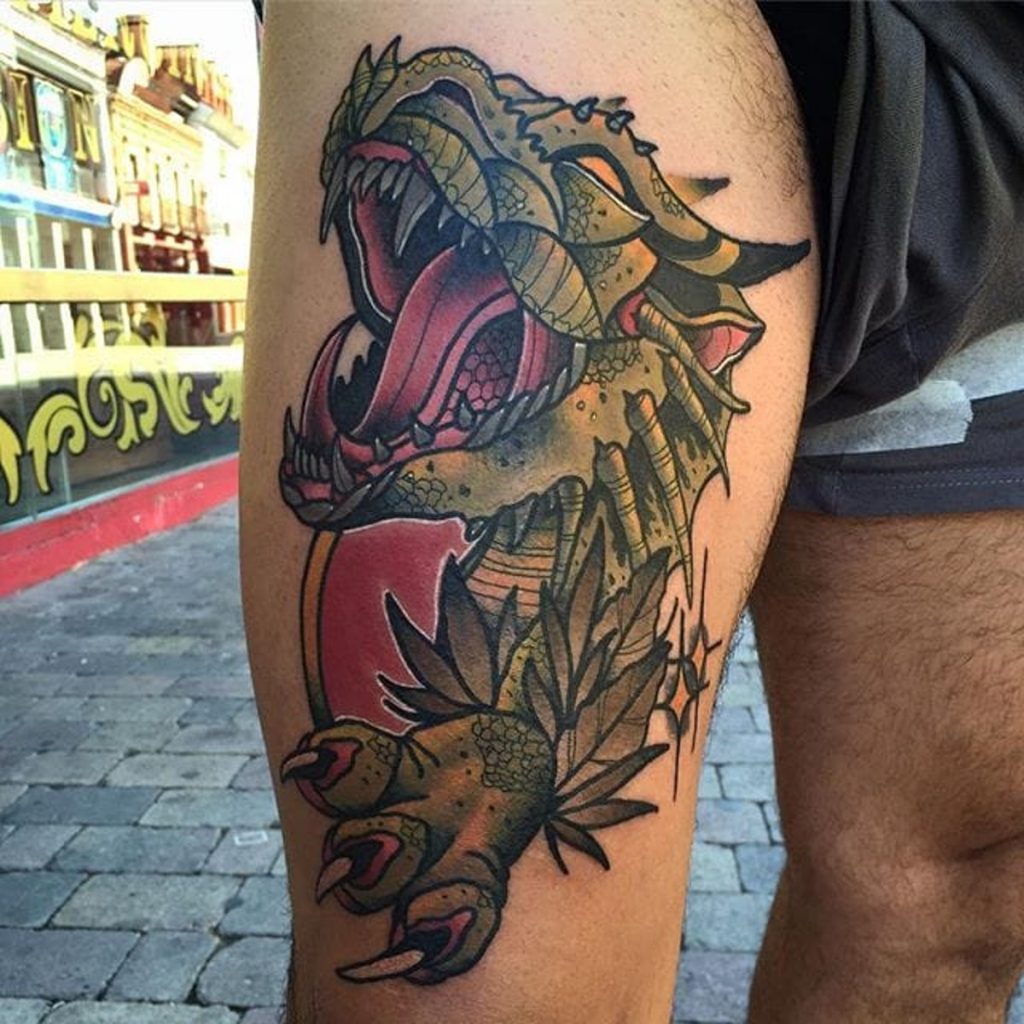 Tribal dragon leg tattoo