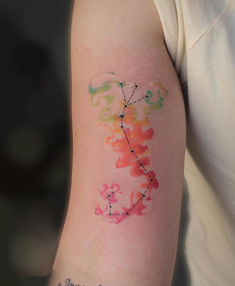 Watercolor scorpion constellation on bicep