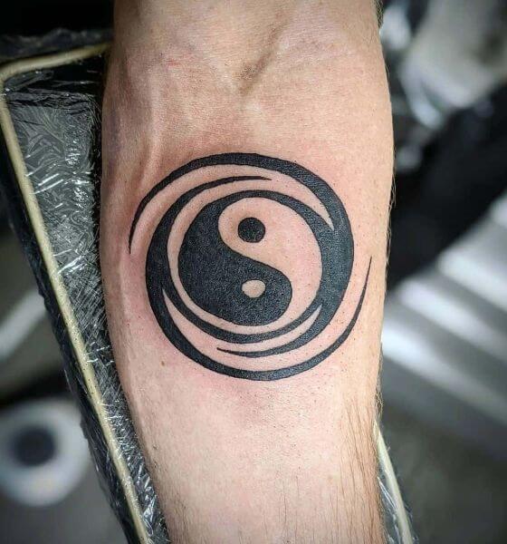 Yin Yang Tribal Tattoo on Arm