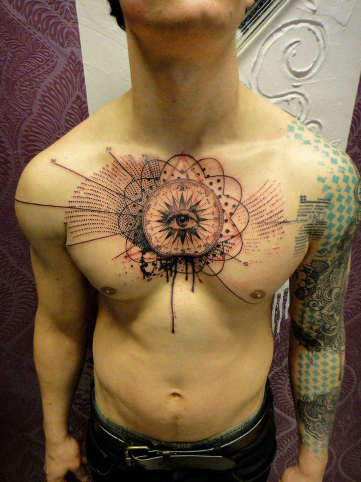 human eye stares chest in an abstract tattoo