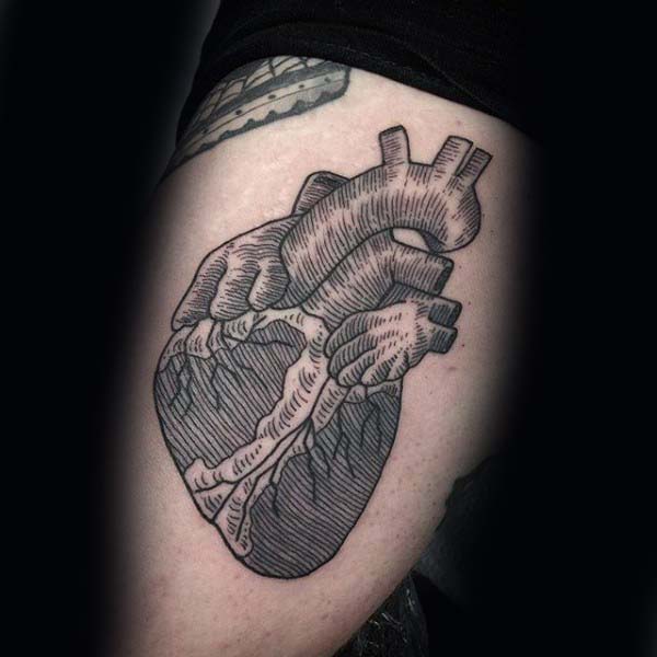 Anatomical heart woodcut mens thigh tattoo idea inspiration