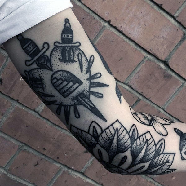 Arms grey dagger and floral tattoo Arms grey dagger and floral tattoo