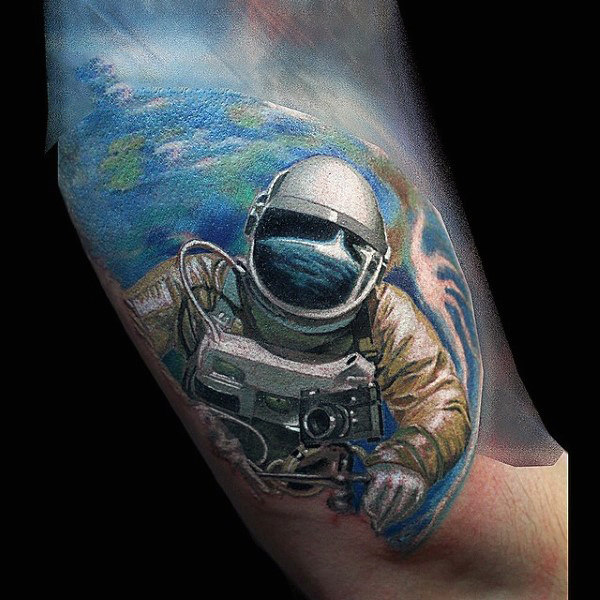 Astronaut leaving earth tattoo men forearm