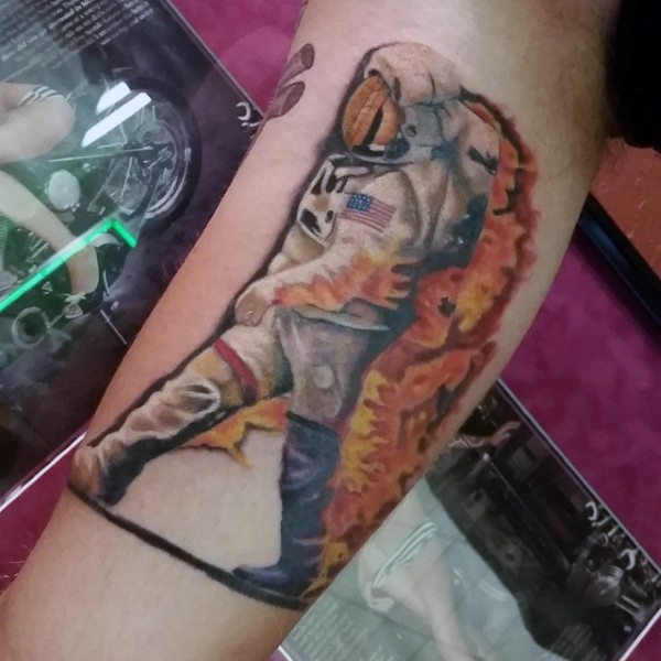 Astronaut on fire tattoo men arm