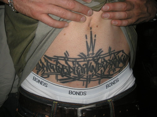 Awesome grey ink graffiti tattoo on belly