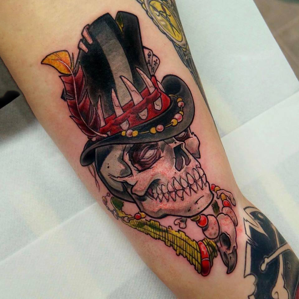 Big Skull Cartoon With Hat Feather Inked On Thigh