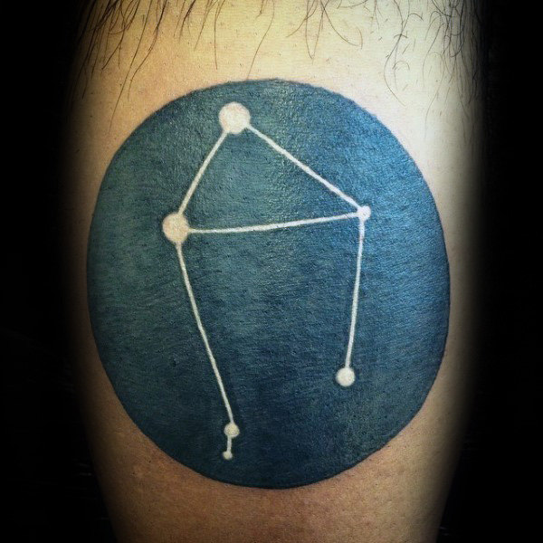 Black ink circle with white ink libra constellation male tattoo ideas on arm
