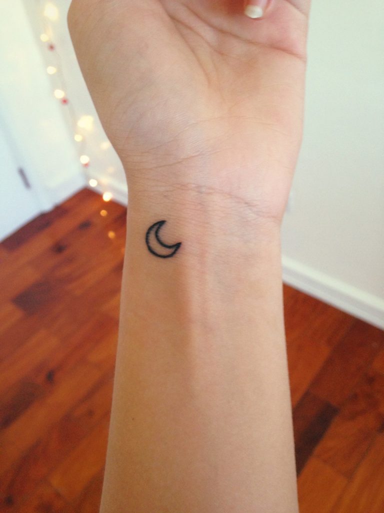 Black-small-crescent-moon-tattoo-on-the-wrist