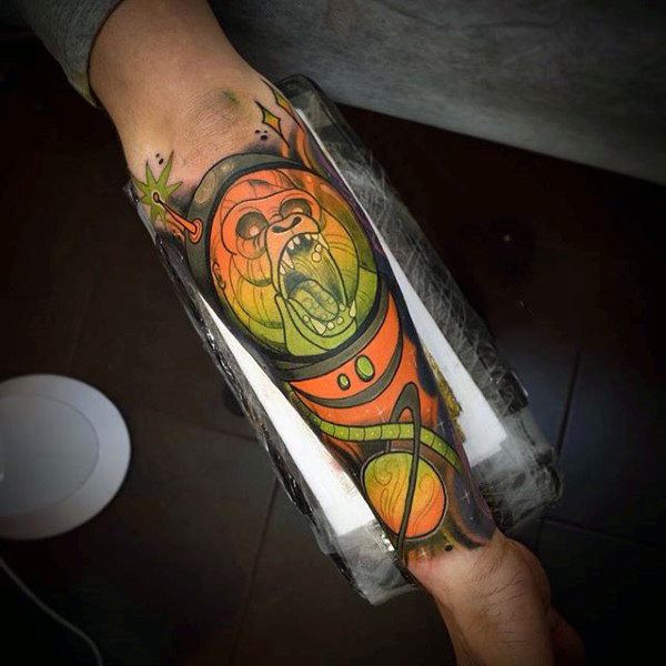 Blazing evil ogre in space tattoo mens forearms