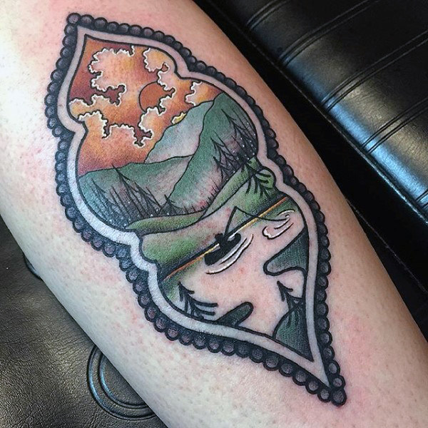 Cartoon man fishing on lake forearm tattoo on man