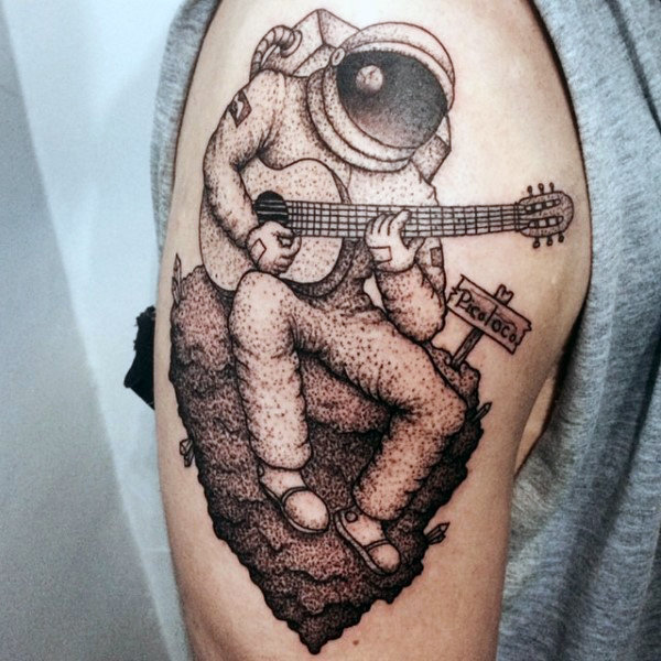 Chic astronaut playing guitar tattoo mens upper arm Chic astronaut playing guitar tattoo mens upper arm