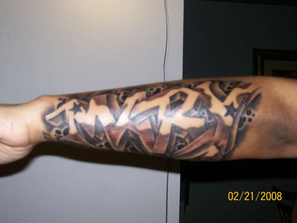 Classic grey ink graffiti tattoo on left sleeve