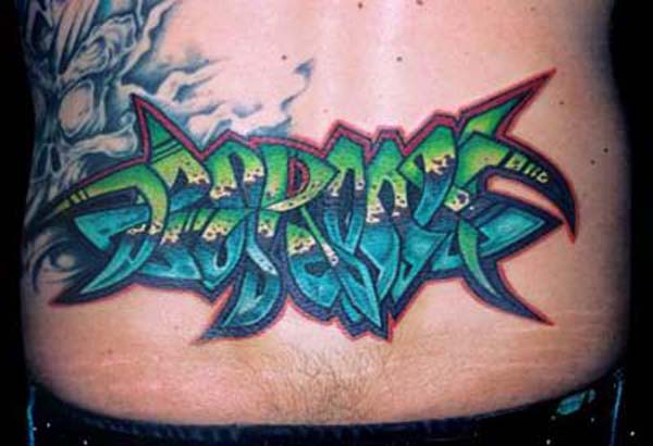 Color ink graffiti tattoo on lowerback