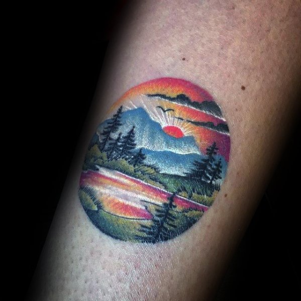 Cool colorful mens detailed small nature mountains tattoo on arm