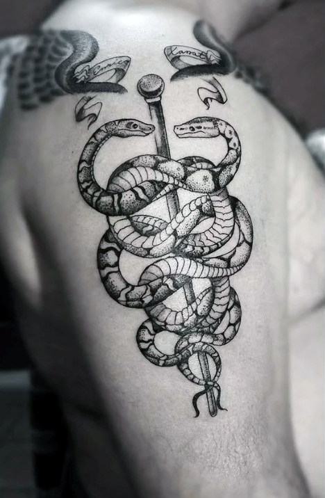 Cool guys caduceus black ink upper arm tattoo ideas