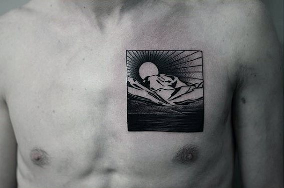 Cool square male upper chest nature landscape small tattoo