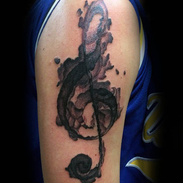 Cool treble clef watercolor upper arm tattoo for gentlemen