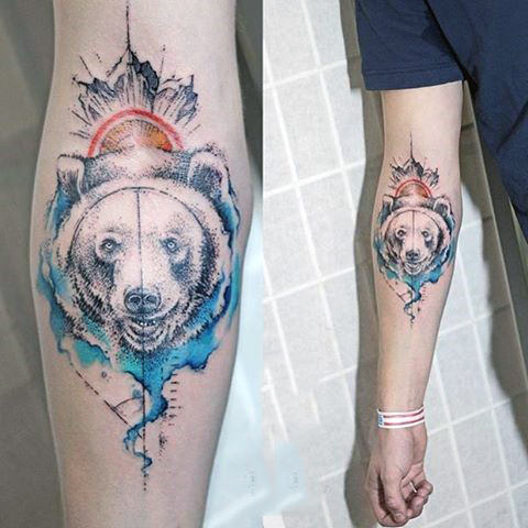 Cool wolf head watercolor tattoo on forearms for guys