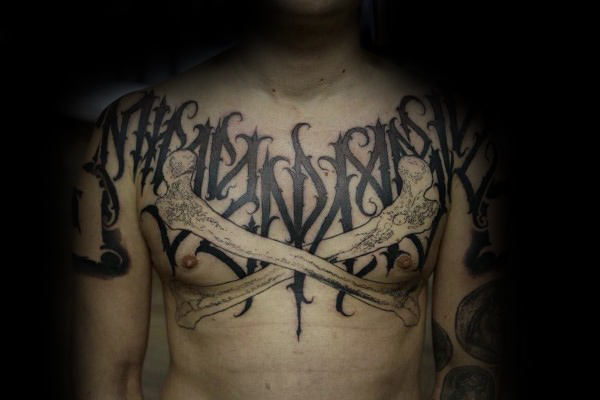 Cross bones script mens chest tattoo