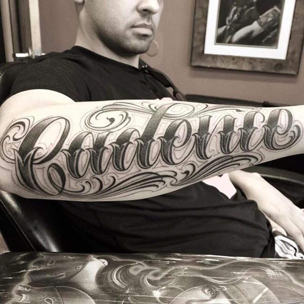Cursive letters tattoo