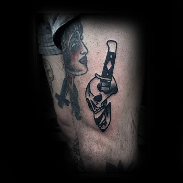 Dagger in skull tattoo male forearms Dagger in skull tattoo male forearms