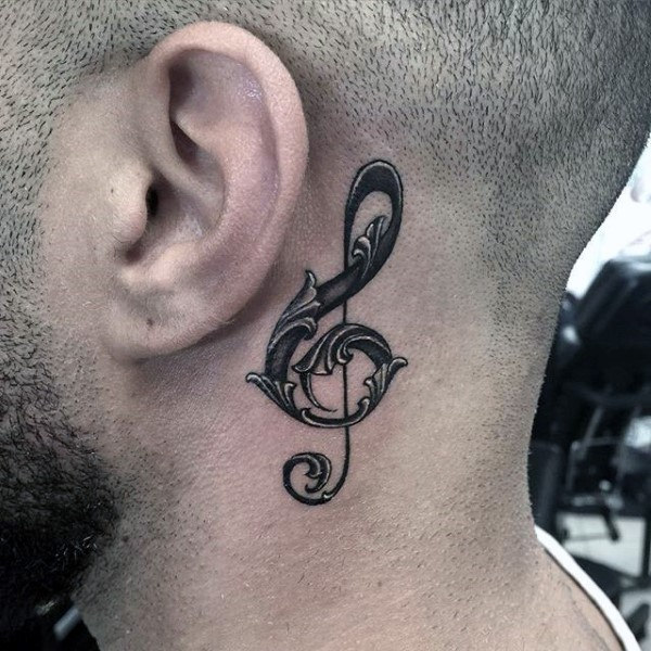 Decorative music note mens behind the ear tattoo