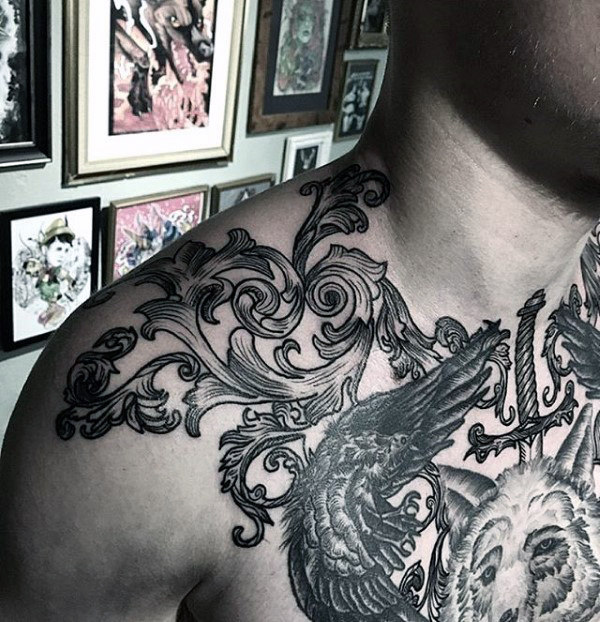 Detailed woodcut filigree tattoo on mans shoulder