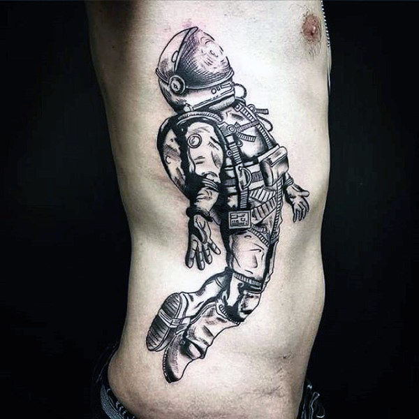 Floating backwards astronaut tattoo men torso