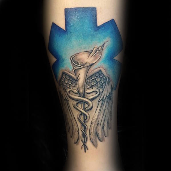 Flower with blue star of life and wings guys leg tattoo
