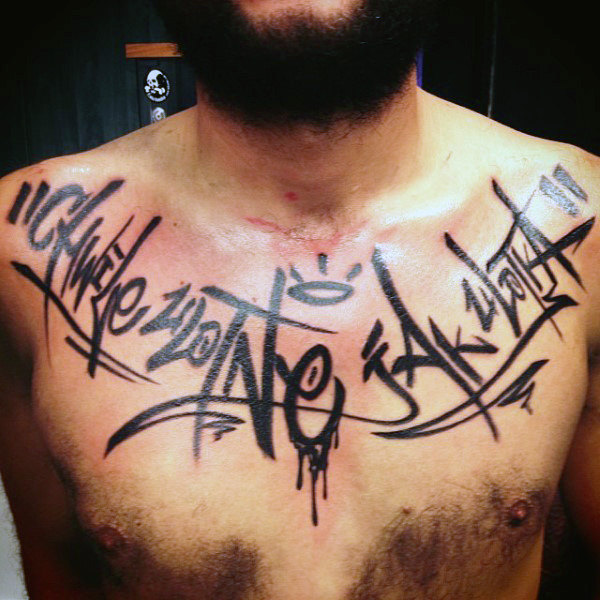 Graffiti street art tag chest mens tattoo in black ink