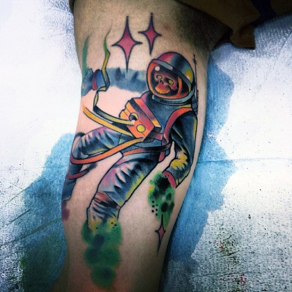 Graphical art of astronaut tattoo on guys arm