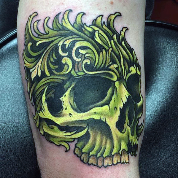 Green skull mens filigree arm tattoo