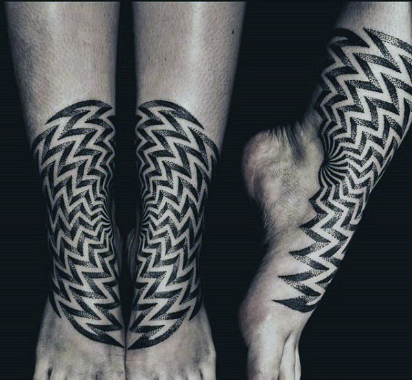 Guys ankles black and white zigzag dotwork tattoo
